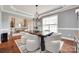Dining room featuring a chandelier and natural light, seamlessly connects to the entry foyer at 645 Brookhaven Dr, Fort Mill, SC 29708