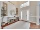 Bright foyer with hardwood floors, a console table, and a view of the staircase at 645 Brookhaven Dr, Fort Mill, SC 29708