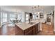Modern kitchen with granite countertops, stainless steel appliances, open to the breakfast nook and living room at 645 Brookhaven Dr, Fort Mill, SC 29708