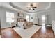 Spacious main bedroom features tray ceilings, hardwood floors, and serene decor for relaxation at 645 Brookhaven Dr, Fort Mill, SC 29708