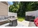Private backyard patio with a fire pit, cozy seating, and a well-maintained fence at 740 Tavern Ct # 7, Rock Hill, SC 29732