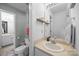 Bright bathroom featuring a vanity with a sink, toilet, and a view into another bathroom area at 740 Tavern Ct # 7, Rock Hill, SC 29732