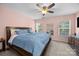 Comfortable bedroom featuring a ceiling fan, natural light, and neutral decor at 740 Tavern Ct # 7, Rock Hill, SC 29732