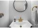 Stylish powder room with a unique mirror and elegant fixtures at 740 Tavern Ct # 7, Rock Hill, SC 29732