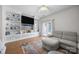 Bright living room with custom built-ins and shelving and a comfortable seating arrangement at 740 Tavern Ct # 7, Rock Hill, SC 29732