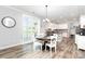 Bright dining area with hardwood floors and seamless flow to the outdoor patio at 7414 Meridale Forest Dr, Charlotte, NC 28269