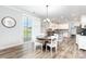 Bright dining area with hardwood floors and seamless flow to the outdoor patio at 7414 Meridale Forest Dr, Charlotte, NC 28269