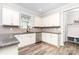 Bright kitchen features granite countertops, stainless steel appliances, and ample white cabinetry at 7414 Meridale Forest Dr, Charlotte, NC 28269