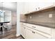 Bright kitchen featuring granite countertops, modern cabinets, and wood-look flooring at 7414 Meridale Forest Dr, Charlotte, NC 28269