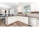 This kitchen boasts granite countertops, stainless steel appliances, and a breakfast bar at 7414 Meridale Forest Dr, Charlotte, NC 28269