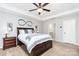Cozy main bedroom with ceiling fan, natural lighting, and modern furniture at 7414 Meridale Forest Dr, Charlotte, NC 28269