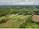 Aerial view of a property with acreage, approximate lot lines, and an in-ground pool at 7660 Bud Davis Rd, Vale, NC 28168