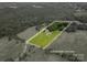 Aerial view of a property with a green lawn, an in-ground pool, and approximate lot lines at 7660 Bud Davis Rd, Vale, NC 28168
