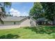 The home's exterior includes a screened-in porch that overlooks a large, grassy, tree-lined yard at 7660 Bud Davis Rd, Vale, NC 28168