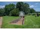 The backyard has a building that could be used as a basement, additional storage, or a workshop at 7660 Bud Davis Rd, Vale, NC 28168