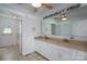 Bright bathroom with double sink vanity, large mirror, and separate toilet area at 7660 Bud Davis Rd, Vale, NC 28168