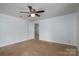 Bright bedroom boasts carpeted floor, fan and lots of natural light at 7660 Bud Davis Rd, Vale, NC 28168