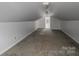 Bonus room with neutral carpeting, white walls, and natural light from a skylight at 7660 Bud Davis Rd, Vale, NC 28168