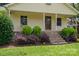 Charming home featuring a cozy porch, stone stairs, and meticulously manicured landscaping at 7660 Bud Davis Rd, Vale, NC 28168