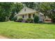 Inviting home exterior with landscaped front yard and charming porch at 7660 Bud Davis Rd, Vale, NC 28168