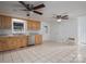 Open kitchen features tile floors, wood cabinets and stainless steel appliances at 7660 Bud Davis Rd, Vale, NC 28168