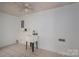 A utility sink in a room with tile flooring, offering practical space for cleaning at 7660 Bud Davis Rd, Vale, NC 28168
