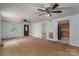The interior of this home has carpet, multiple ceiling fans, and access to a kitchen at 7660 Bud Davis Rd, Vale, NC 28168