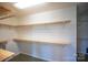 Spacious walk-in closet with multiple levels of shelving and carpeted floor at 7660 Bud Davis Rd, Vale, NC 28168