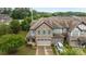 Aerial view of a two-story home with a stone exterior and two-car garage in a lovely neighborhood at 809 Ayrshire Ave, Fort Mill, SC 29708