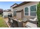 An inviting backyard patio area with outdoor seating, a grill, and a well-maintained lawn at 809 Ayrshire Ave, Fort Mill, SC 29708