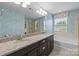 Bathroom with dual vanity, granite countertop, large mirror and fixtures, plus separate shower and tub at 809 Ayrshire Ave, Fort Mill, SC 29708