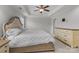 Comfortable primary bedroom featuring a king bed, tray ceilings and neutral decor at 809 Ayrshire Ave, Fort Mill, SC 29708