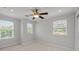 Bedroom featuring neutral walls, ceiling fan, carpet flooring, and natural light from three windows at 809 Ayrshire Ave, Fort Mill, SC 29708