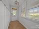 Bright entryway featuring hardwood floors, beadboard paneling, and natural light at 809 Ayrshire Ave, Fort Mill, SC 29708