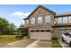 Lovely two-story home boasts a stone and siding exterior with an attached two-car garage at 809 Ayrshire Ave, Fort Mill, SC 29708
