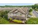 Charming townhome featuring a stone facade, covered porch, and lush landscaping in a desirable community at 809 Ayrshire Ave, Fort Mill, SC 29708