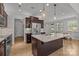 Modern kitchen featuring a granite island, stainless steel appliances, and dark wood cabinetry at 809 Ayrshire Ave, Fort Mill, SC 29708