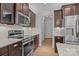 Stylish kitchen with stainless steel appliances, granite countertops, and ample cabinet space at 809 Ayrshire Ave, Fort Mill, SC 29708