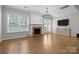 Bright living room featuring hardwood floors, fireplace, and plenty of natural light at 809 Ayrshire Ave, Fort Mill, SC 29708
