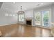 Cozy living room with fireplace, hardwood floors, and ample natural light at 809 Ayrshire Ave, Fort Mill, SC 29708