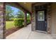 Charming covered porch with stone pillars and manicured landscaping welcomes you home at 809 Ayrshire Ave, Fort Mill, SC 29708
