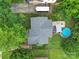 An aerial shot shows the home, roof, pool, patio area, trees, and other landscaping at 842 Cherry S Rd, Rock Hill, SC 29732