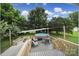 Back deck with outdoor furniture and an above ground pool with surrounding trees at 842 Cherry S Rd, Rock Hill, SC 29732