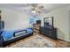 Inviting bedroom with a ceiling fan, hardwood floors, and classic furnishings, offering a comfortable and stylish personal space at 842 Cherry S Rd, Rock Hill, SC 29732