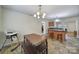 Bright dining area with a wooden table, seating, and a view into the kitchen, providing a welcoming space for meals at 842 Cherry S Rd, Rock Hill, SC 29732