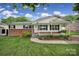Charming home with a brick and vinyl facade, complemented by a welcoming front porch swing at 842 Cherry S Rd, Rock Hill, SC 29732