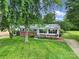 Quaint home featuring a well-manicured lawn and inviting front porch with a porch swing at 842 Cherry S Rd, Rock Hill, SC 29732