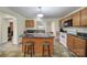 Kitchen features wooden cabinets, a center island, and tiled floors at 842 Cherry S Rd, Rock Hill, SC 29732