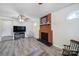 Living room features a red brick fireplace and laminate floors at 842 Cherry S Rd, Rock Hill, SC 29732