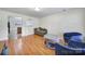 Inviting living room with hardwood floors, comfortable seating, and views into the adjacent rooms at 842 Cherry S Rd, Rock Hill, SC 29732